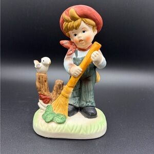 Charming Boy Figurine with Broom and Bird
